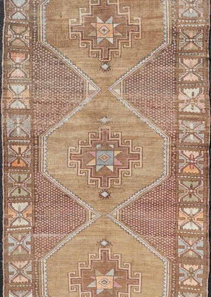 Unique & Colorful Turkish Kars Runner with Tribal Designs and Geometric Motifs Vintage Turkish runner in Brown background, accent colors, soft red, tan, green, light blue, taupe, rug/TU - MTU - 4956, country of origin / type: Turkey / Oushak, circa... - Keivan Woven ArtsTU - MTU - 4956 - 18649Rug