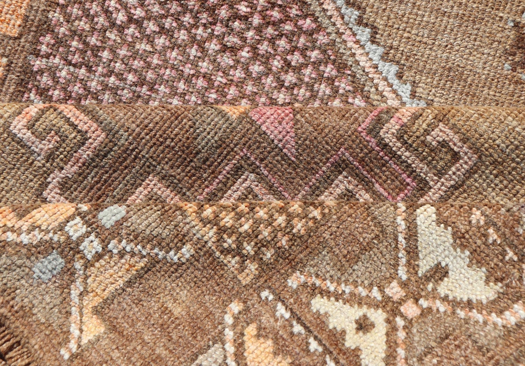 Unique & Colorful Turkish Kars Runner with Tribal Designs and Geometric Motifs Vintage Turkish runner in Brown background, accent colors, soft red, tan, green, light blue, taupe, rug/TU - MTU - 4956, country of origin / type: Turkey / Oushak, circa... - Keivan Woven ArtsTU - MTU - 4956 - 18649Rug