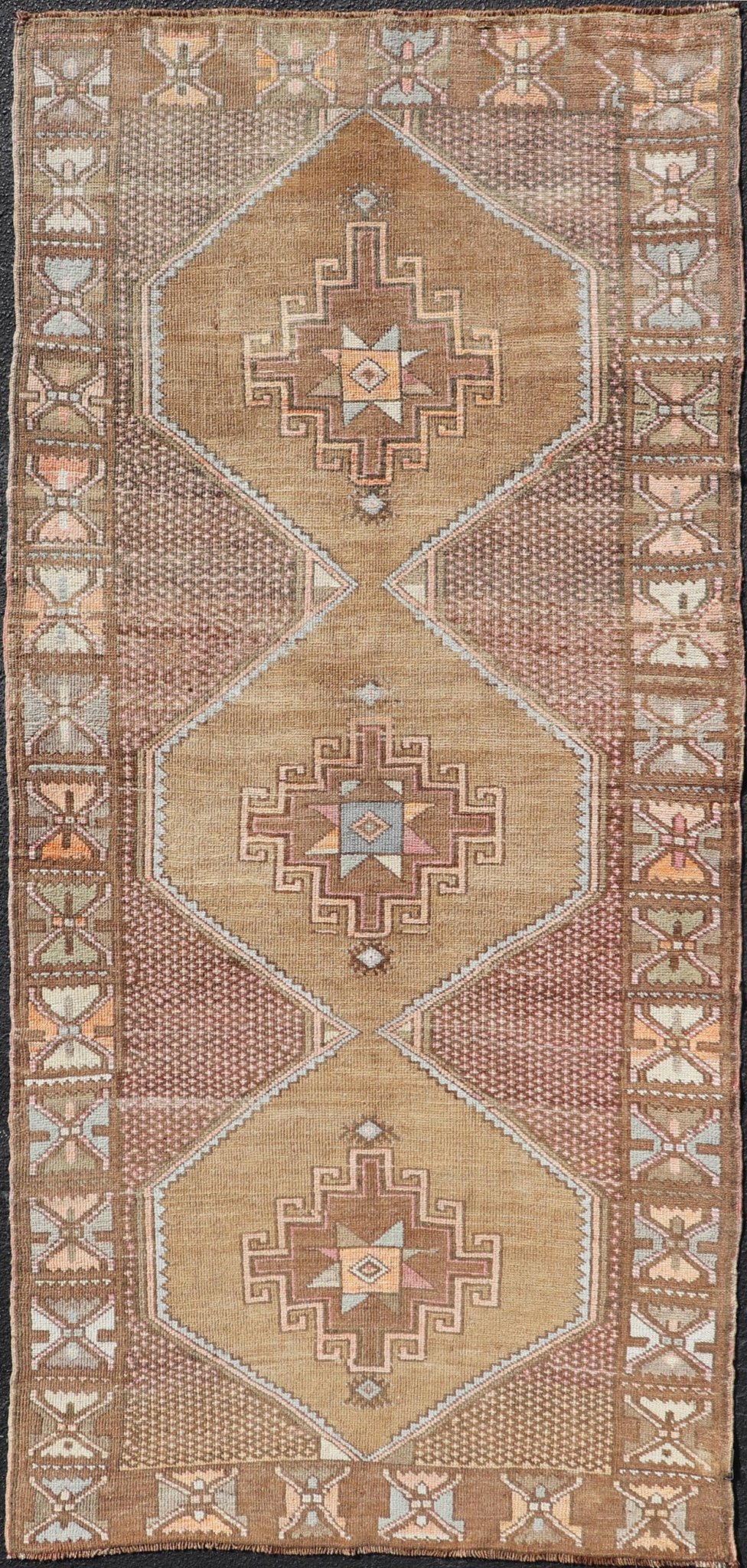 Unique & Colorful Turkish Kars Runner with Tribal Designs and Geometric Motifs Vintage Turkish runner in Brown background, accent colors, soft red, tan, green, light blue, taupe, rug/TU - MTU - 4956, country of origin / type: Turkey / Oushak, circa... - Keivan Woven ArtsTU - MTU - 4956 - 18649Rug