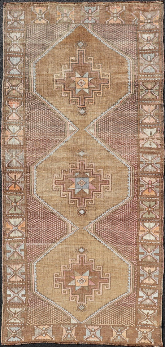 Unique & Colorful Turkish Kars Runner with Tribal Designs and Geometric Motifs Vintage Turkish runner in Brown background, accent colors, soft red, tan, green, light blue, taupe, rug/TU - MTU - 4956, country of origin / type: Turkey / Oushak, circa... - Keivan Woven ArtsTU - MTU - 4956 - 18649Rug