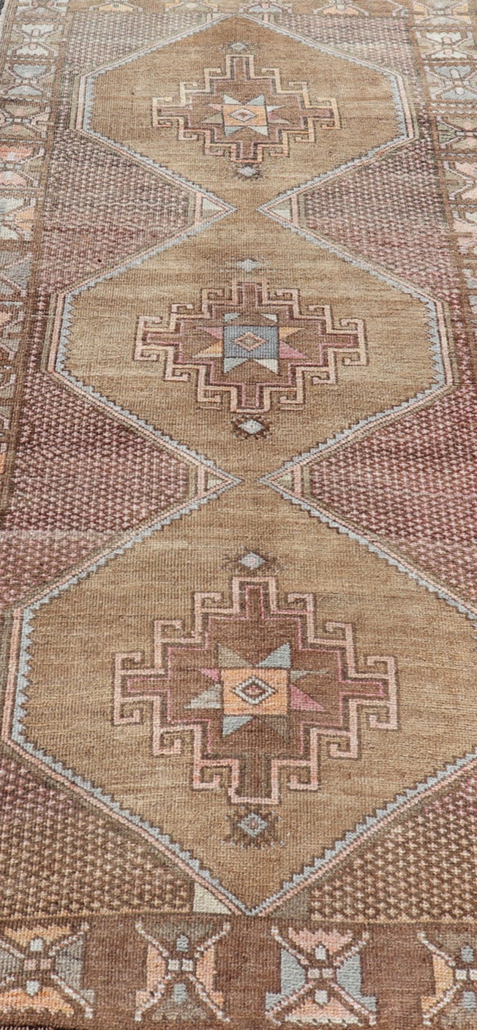 Unique & Colorful Turkish Kars Runner with Tribal Designs and Geometric Motifs Vintage Turkish runner in Brown background, accent colors, soft red, tan, green, light blue, taupe, rug/TU - MTU - 4956, country of origin / type: Turkey / Oushak, circa... - Keivan Woven ArtsTU - MTU - 4956 - 18649Rug
