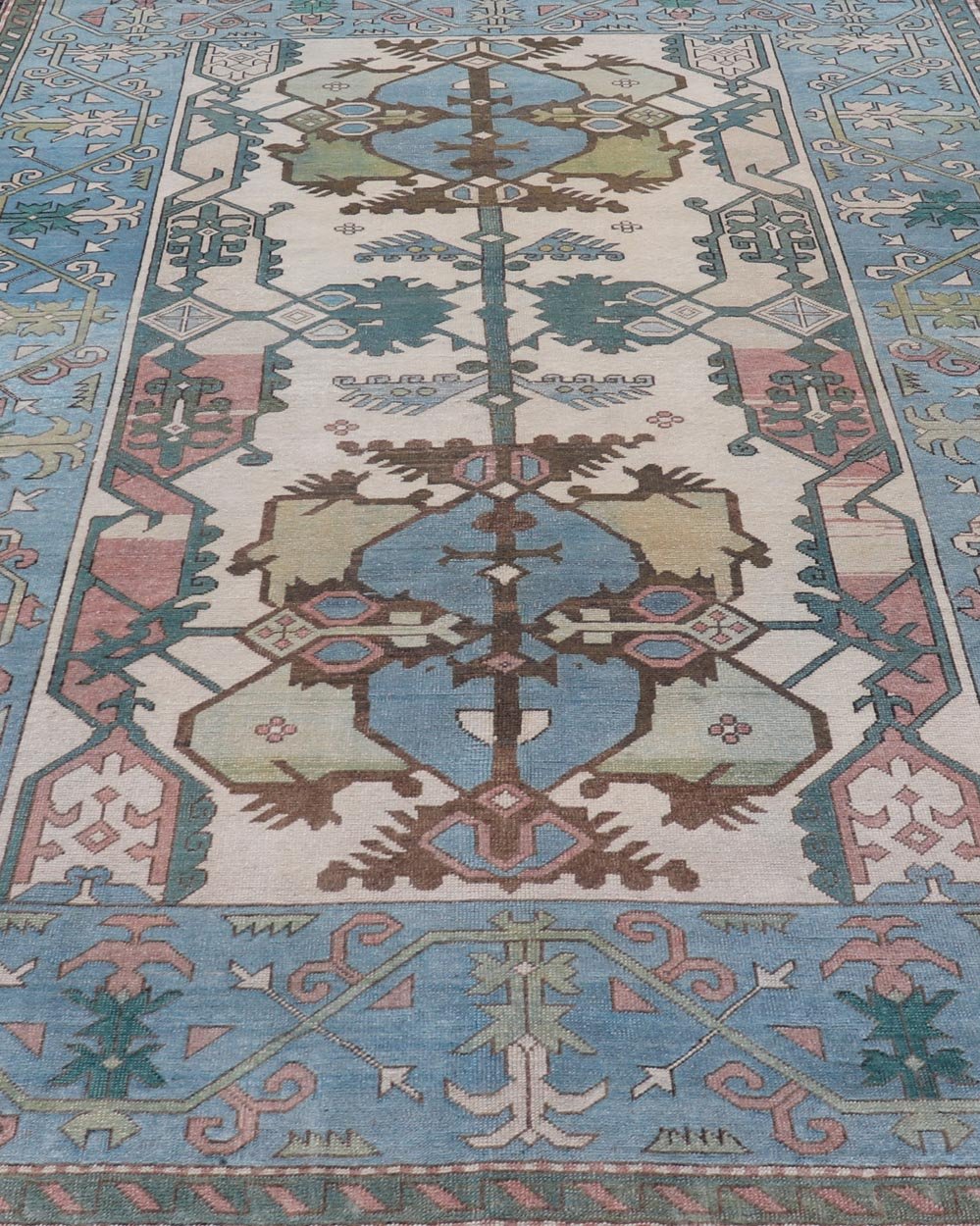 Unique Turkish Rug with Bold Florals in Lt, blue, Lt, Green, Teal & Pink Unusual and Unique Turkish Rug with Bold Florals in Lt, blue, Lt, Green, Teal & Pink, ivory. Keivan Woven Arts rug/TU - MTU - 4960. Set on Ivory background and light blue borde... - Keivan Woven ArtsTU - MTU - 4960 - 19010