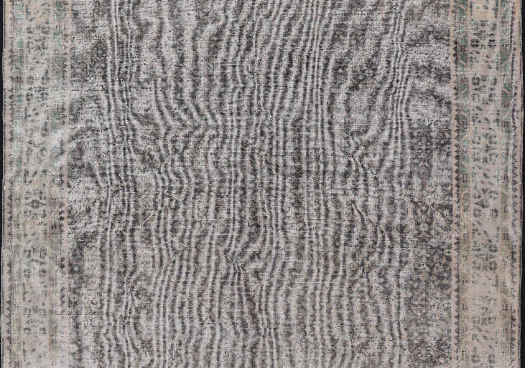 Vintage Hand - Knotted Distressed Turkish Rug in Wool with All - Over Floral Pattern This vintage Turkish Oushak rug has been hand - knotted in wool and features an all - over sub - geometric distressed floral design rendered in cream, blue, green and ivo... - Keivan Woven ArtsTU - MTU - 4962 - 19172