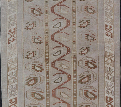 Measures: 3'5 x 6'2 This one - of - a - kind Turkish Oushak has a light taupe colored background reaching the field and the border. The unique tribal designs within the field are rendered in brick red, brown, and forest green. The complimentary borde... - Keivan Woven ArtsTU - MTU - 6003 - 19034