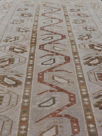 Measures: 3'5 x 6'2 This one - of - a - kind Turkish Oushak has a light taupe colored background reaching the field and the border. The unique tribal designs within the field are rendered in brick red, brown, and forest green. The complimentary borde... - Keivan Woven ArtsTU - MTU - 6003 - 19034