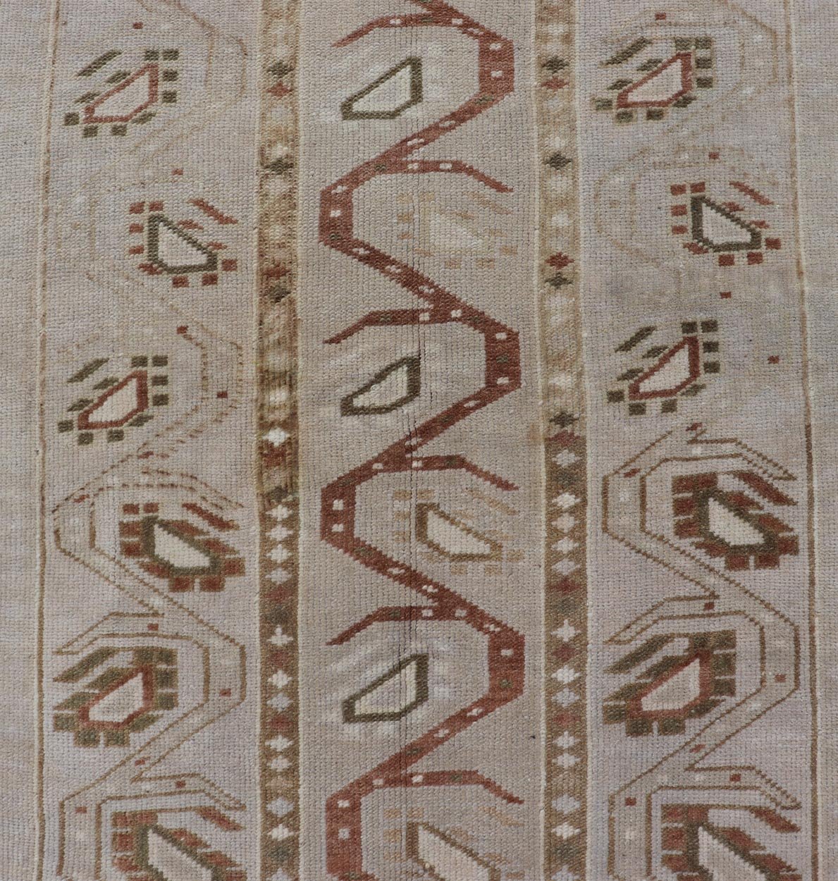Measures: 3'5 x 6'2 This one - of - a - kind Turkish Oushak has a light taupe colored background reaching the field and the border. The unique tribal designs within the field are rendered in brick red, brown, and forest green. The complimentary borde... - Keivan Woven ArtsTU - MTU - 6003 - 19034