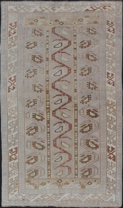 Measures: 3'5 x 6'2 This one - of - a - kind Turkish Oushak has a light taupe colored background reaching the field and the border. The unique tribal designs within the field are rendered in brick red, brown, and forest green. The complimentary borde... - Keivan Woven ArtsTU - MTU - 6003 - 19034
