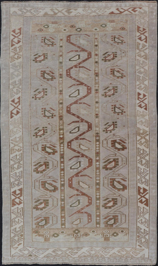 Measures: 3'5 x 6'2 This one - of - a - kind Turkish Oushak has a light taupe colored background reaching the field and the border. The unique tribal designs within the field are rendered in brick red, brown, and forest green. The complimentary borde... - Keivan Woven ArtsTU - MTU - 6003 - 19034