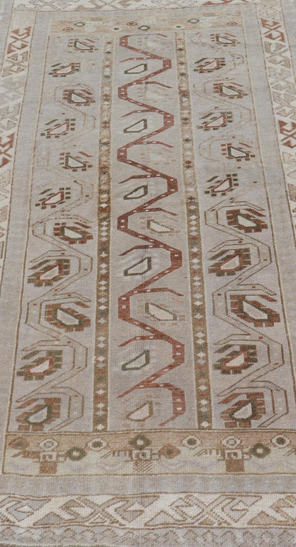 Measures: 3'5 x 6'2 This one - of - a - kind Turkish Oushak has a light taupe colored background reaching the field and the border. The unique tribal designs within the field are rendered in brick red, brown, and forest green. The complimentary borde... - Keivan Woven ArtsTU - MTU - 6003 - 19034