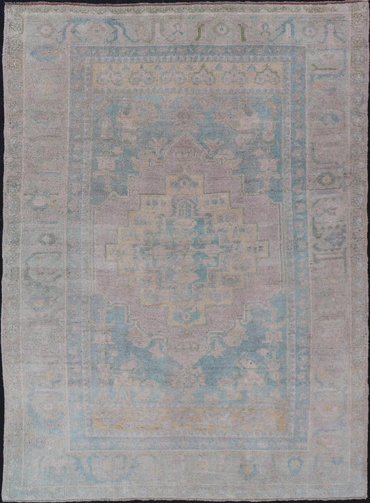 Light Colored Turkish Vintage Oushak Rug with Medallion Design Measures: 4'10 x 7'0 This vintage Turkish Oushak features a large central medallion and a complimentary stylized border. The charming palette consists of muted shades of bl... - Keivan Woven ArtsTU - MTU - 6006 - 19040
