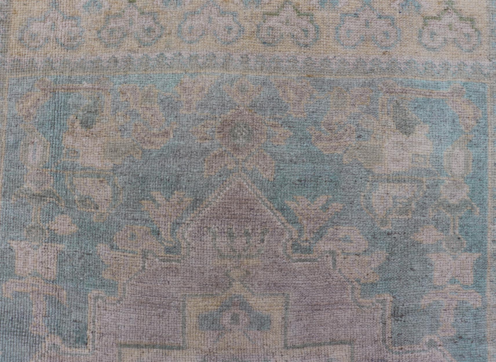 Light Colored Turkish Vintage Oushak Rug with Medallion Design Measures: 4'10 x 7'0 This vintage Turkish Oushak features a large central medallion and a complimentary stylized border. The charming palette consists of muted shades of bl... - Keivan Woven ArtsTU - MTU - 6006 - 19040Rug