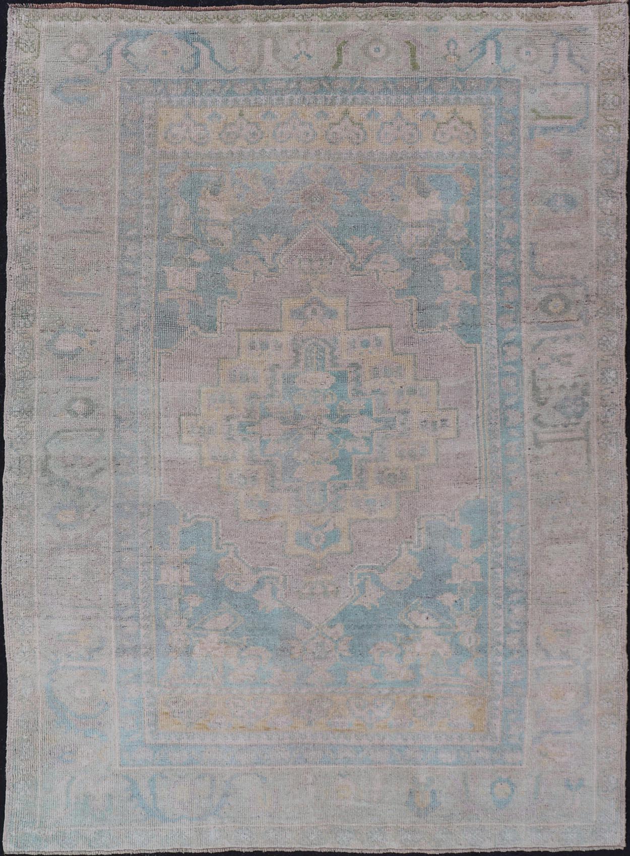 Light Colored Turkish Vintage Oushak Rug with Medallion Design Measures: 4'10 x 7'0 This vintage Turkish Oushak features a large central medallion and a complimentary stylized border. The charming palette consists of muted shades of bl... - Keivan Woven ArtsTU - MTU - 6006 - 19040Rug