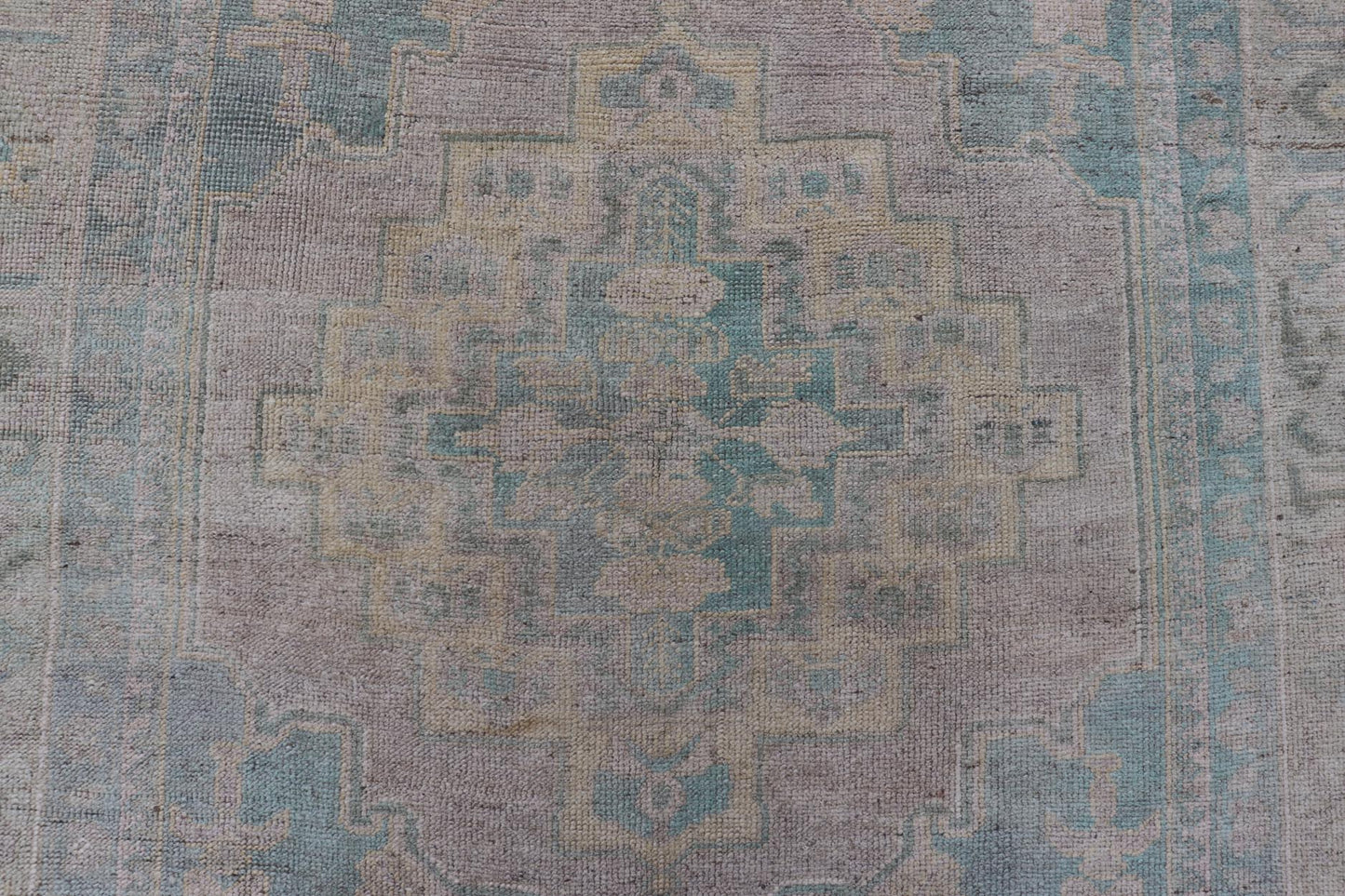 Light Colored Turkish Vintage Oushak Rug with Medallion Design Measures: 4'10 x 7'0 This vintage Turkish Oushak features a large central medallion and a complimentary stylized border. The charming palette consists of muted shades of bl... - Keivan Woven ArtsTU - MTU - 6006 - 19040Rug