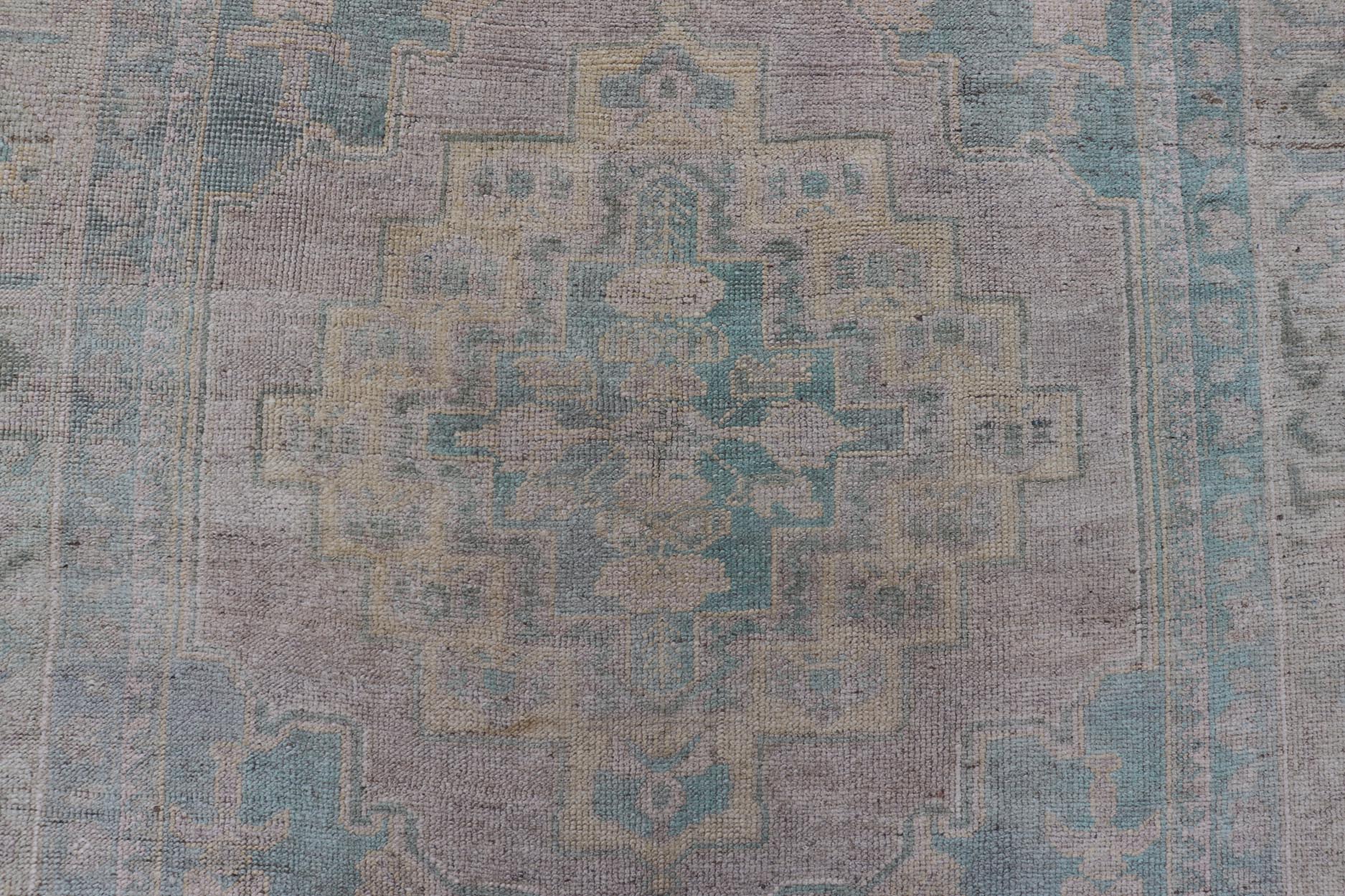 Light Colored Turkish Vintage Oushak Rug with Medallion Design Measures: 4'10 x 7'0 This vintage Turkish Oushak features a large central medallion and a complimentary stylized border. The charming palette consists of muted shades of bl... - Keivan Woven ArtsTU - MTU - 6006 - 19040Rug