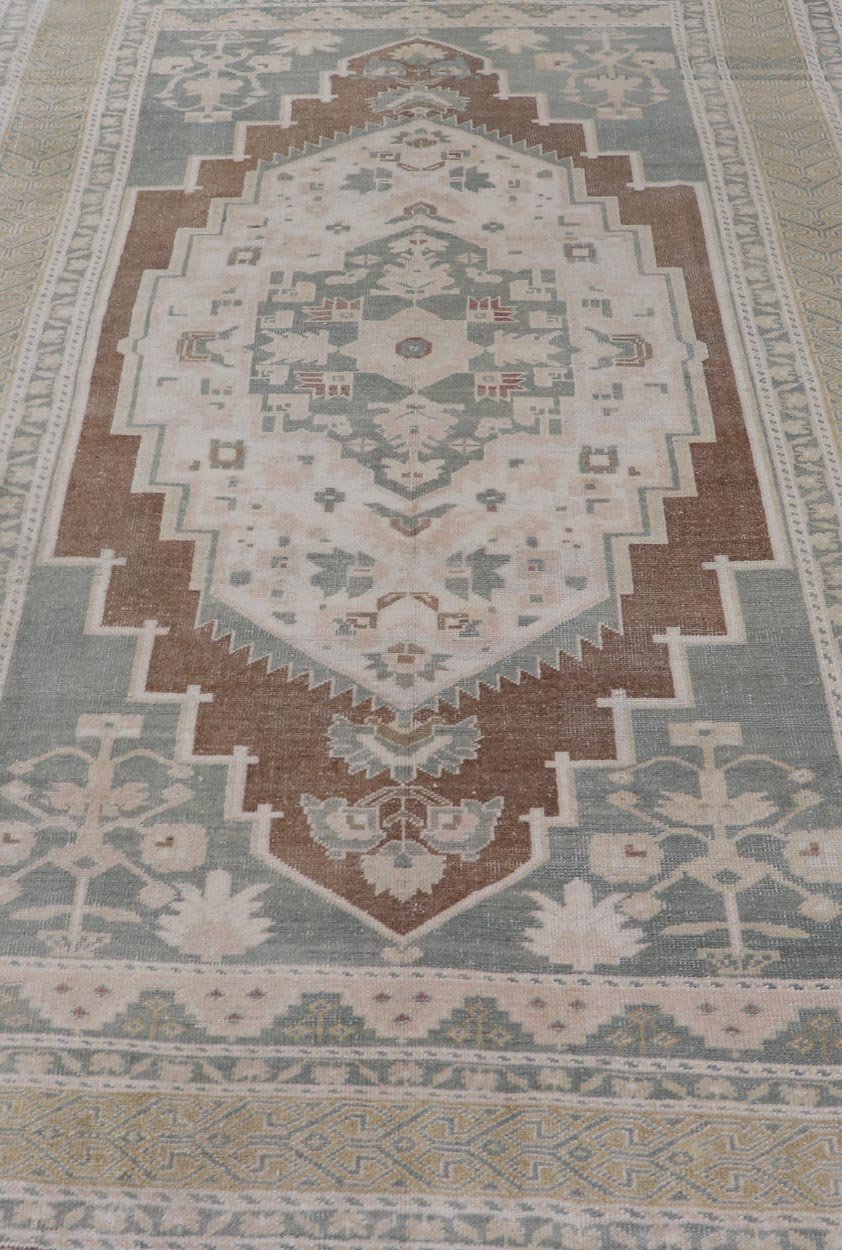 vintage Turkish Oushak with Medallion in Taupe, Lt. Brown, Gray Blue, & Tan Vintage Turkish Oushak Medallion rug in Gray blue, light brown, gray green, taupe, tan and cream Keivan Woven Arts rug/TU - MTU - 6074, country of origin / type: Turkey / O... - Keivan Woven ArtsTU - MTU - 6074 - 19196Rug