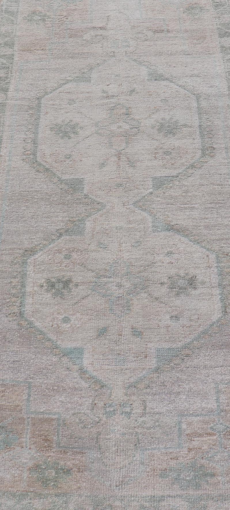 Vintage Turkish short Oushak Runner with Subdued Geometric Medallions in Light Tones Vintage small Oushak carpet with multi - medallion design in cream, tan, and light teal green, teal blue. Keivan Woven Arts rug/TU - MTU - 6103, country of origin / ... - Keivan Woven ArtsTU - MTU - 6103 - 19052