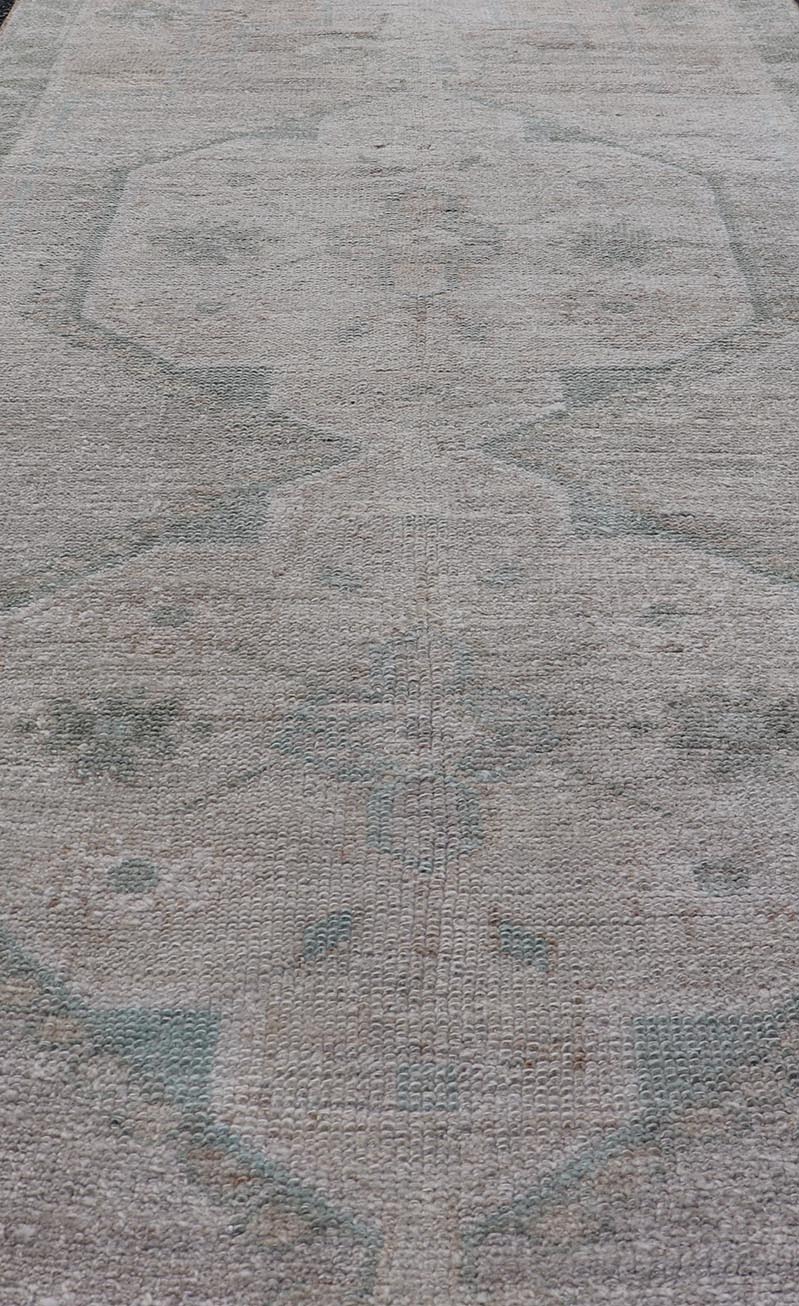 Vintage Turkish short Oushak Runner with Subdued Geometric Medallions in Light Tones Vintage small Oushak carpet with multi - medallion design in cream, tan, and light teal green, teal blue. Keivan Woven Arts rug/TU - MTU - 6103, country of origin / ... - Keivan Woven ArtsTU - MTU - 6103 - 19052