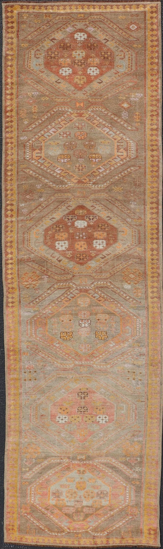 Measures: 2'11 x 10'11 Vintage Turkish Oushak Runner with Tribal Medallions in Brown's, Yellow, and Red. Keivan Woven Arts / rug TU - MTU - 936, country of origin / type: Turkey / Oushak, circa 1940. This vintage Oushak runner features a unique blen... - Keivan Woven ArtsTU - MTU - 936 - 21985
