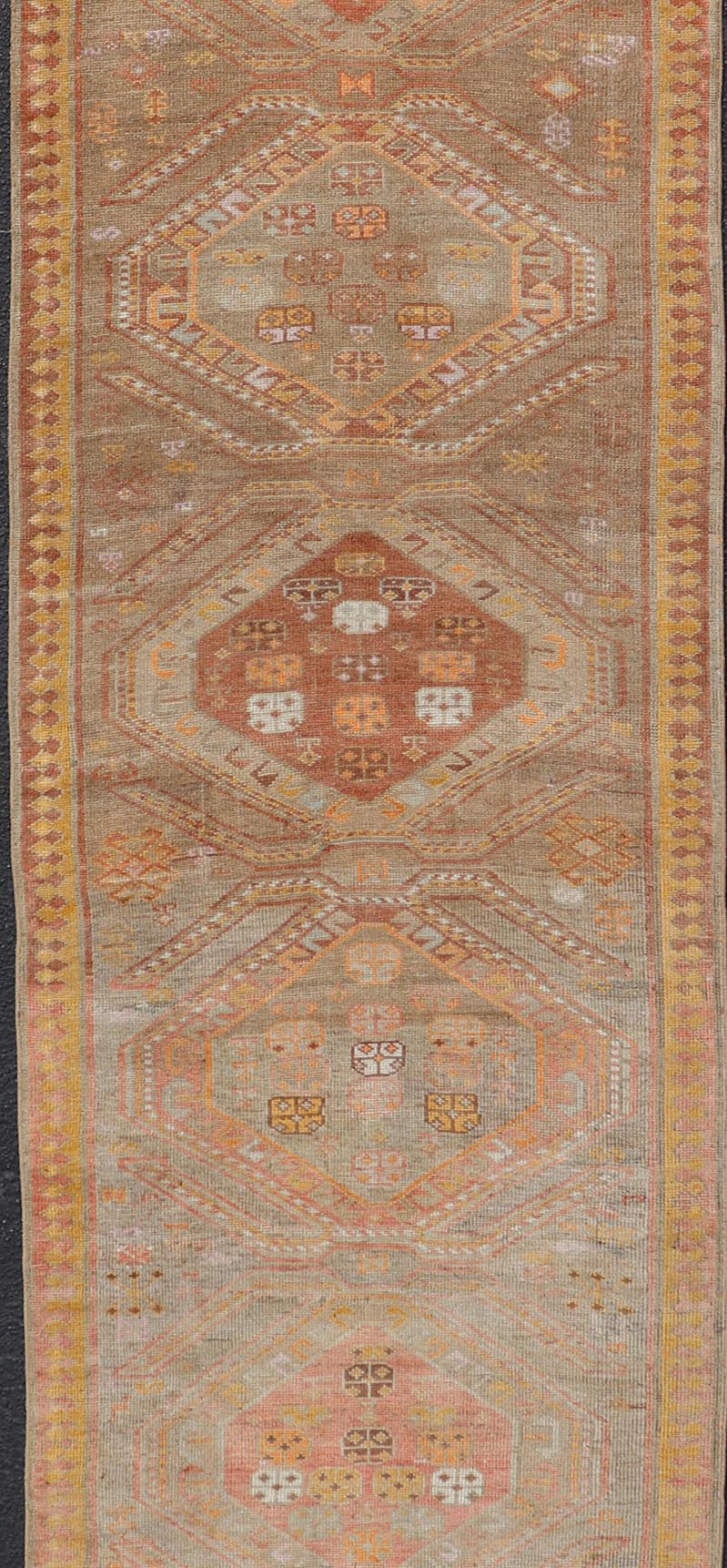 Measures: 2'11 x 10'11 Vintage Turkish Oushak Runner with Tribal Medallions in Brown's, Yellow, and Red. Keivan Woven Arts / rug TU - MTU - 936, country of origin / type: Turkey / Oushak, circa 1940. This vintage Oushak runner features a unique blen... - Keivan Woven ArtsTU - MTU - 936 - 21985Rug
