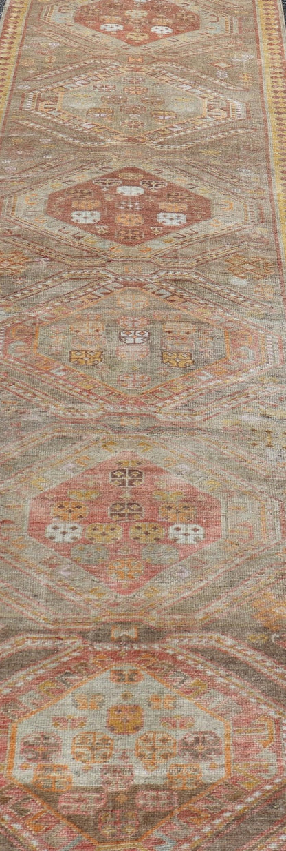 Measures: 2'11 x 10'11 Vintage Turkish Oushak Runner with Tribal Medallions in Brown's, Yellow, and Red. Keivan Woven Arts / rug TU - MTU - 936, country of origin / type: Turkey / Oushak, circa 1940. This vintage Oushak runner features a unique blen... - Keivan Woven ArtsTU - MTU - 936 - 21985Rug
