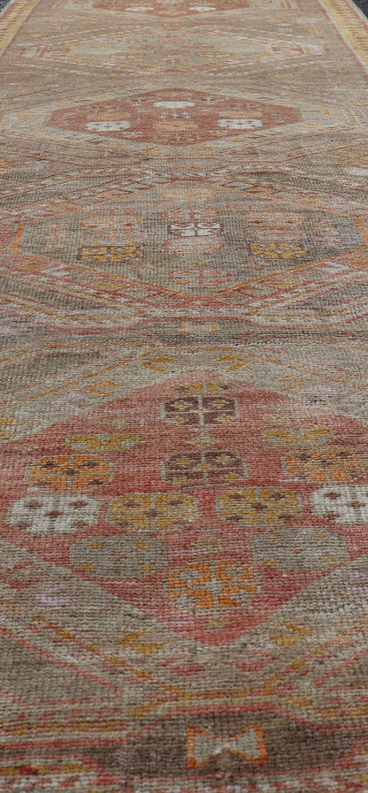 Measures: 2'11 x 10'11 Vintage Turkish Oushak Runner with Tribal Medallions in Brown's, Yellow, and Red. Keivan Woven Arts / rug TU - MTU - 936, country of origin / type: Turkey / Oushak, circa 1940. This vintage Oushak runner features a unique blen... - Keivan Woven ArtsTU - MTU - 936 - 21985Rug