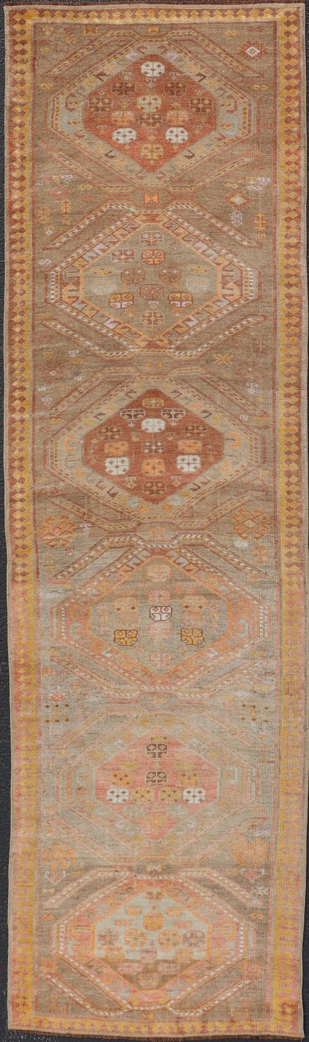 Measures: 2'11 x 10'11 Vintage Turkish Oushak Runner with Tribal Medallions in Brown's, Yellow, and Red. Keivan Woven Arts / rug TU - MTU - 936, country of origin / type: Turkey / Oushak, circa 1940. This vintage Oushak runner features a unique blen... - Keivan Woven ArtsTU - MTU - 936 - 21985Rug