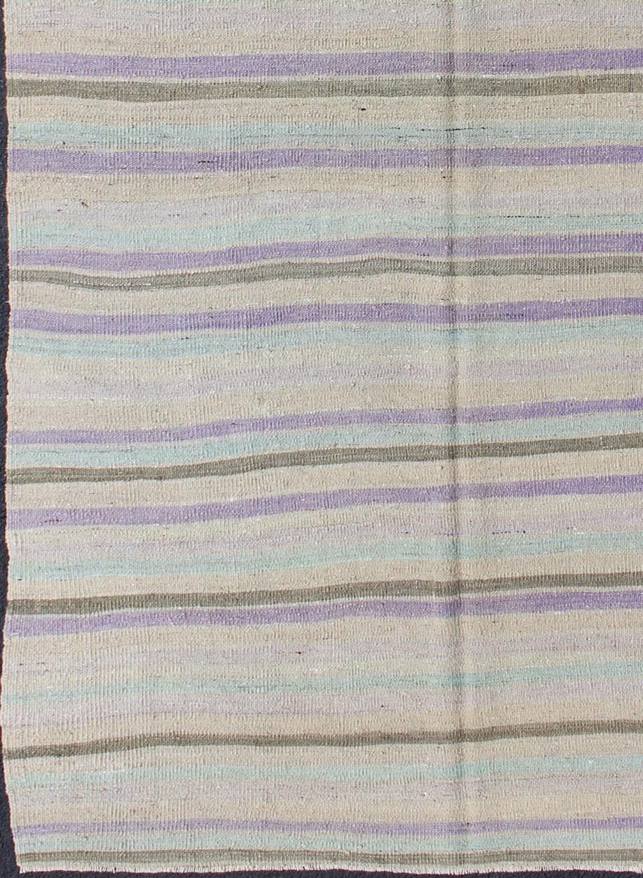 Vintage Turkish Kilim with Stripes in Light green, Pastel Purple, Cream and Taupe rug/tu - mtu - 95040 origin/turkey This vintage Kilim carpet from Mid - Century Turkey features a stripe pattern set atop an grey background. Colors include grey, taupe... - Keivan Woven ArtsTU - MTU - 95040 - 3704Rug