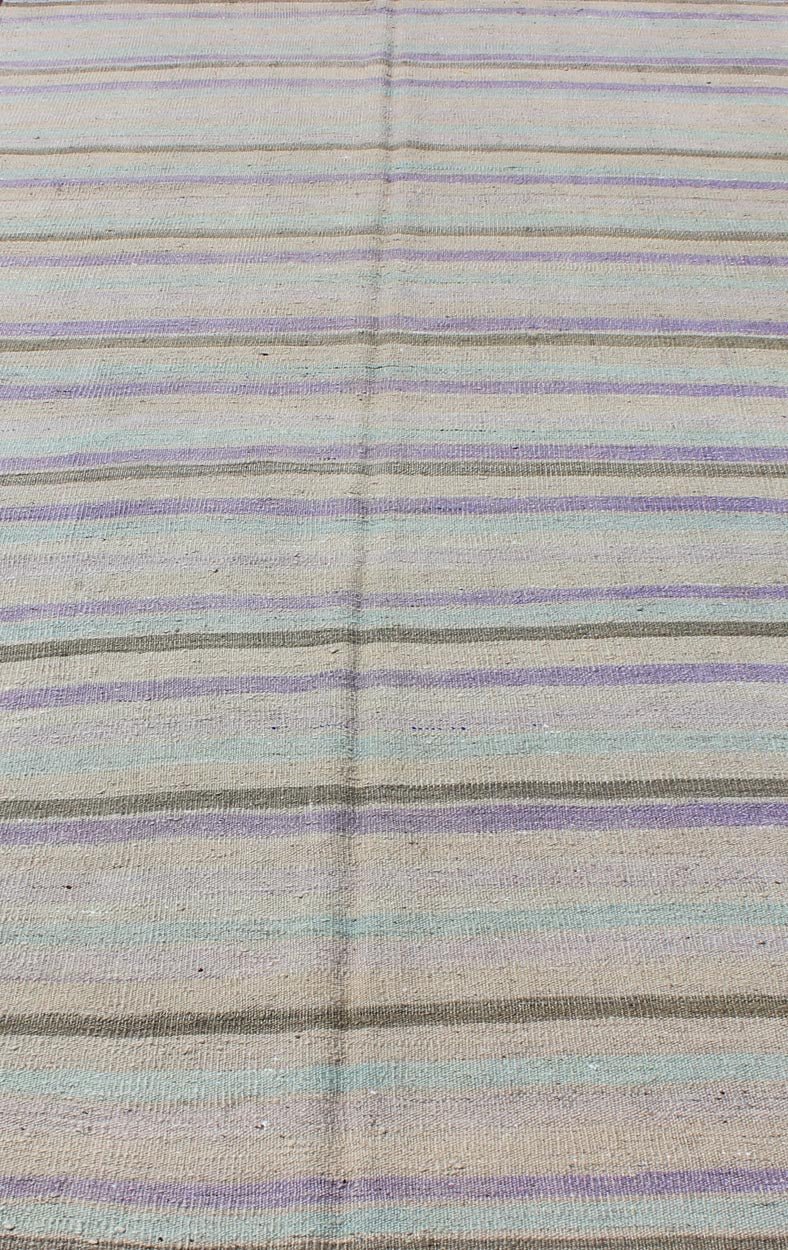Vintage Turkish Kilim with Stripes in Light green, Pastel Purple, Cream and Taupe rug/tu - mtu - 95040 origin/turkey This vintage Kilim carpet from Mid - Century Turkey features a stripe pattern set atop an grey background. Colors include grey, taupe... - Keivan Woven ArtsTU - MTU - 95040 - 3704Rug