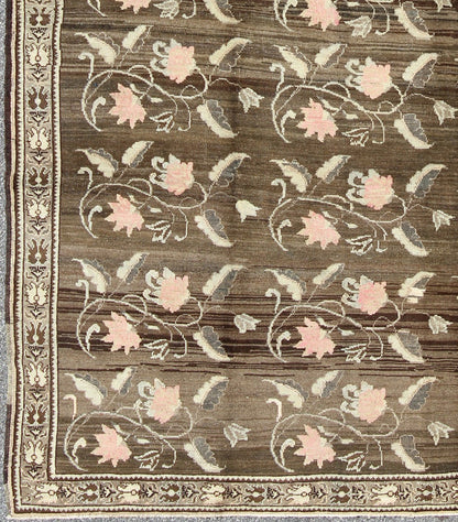 Vintage Kars Rug from Eastern Turkey with Rose Design Brown, Green, and Pink Measures: 7'5 x 11'4 Set on a dark greenish - brown background, the all - encompassing floral pattern of this vintage Turkish Kars is unique. The pale pink and pea... - Keivan Woven ArtsTU - MTU - 95044 - 3904Rug