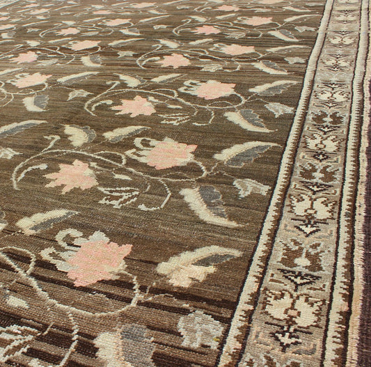 Vintage Kars Rug from Eastern Turkey with Rose Design Brown, Green, and Pink Measures: 7'5 x 11'4 Set on a dark greenish - brown background, the all - encompassing floral pattern of this vintage Turkish Kars is unique. The pale pink and pea... - Keivan Woven ArtsTU - MTU - 95044 - 3904Rug