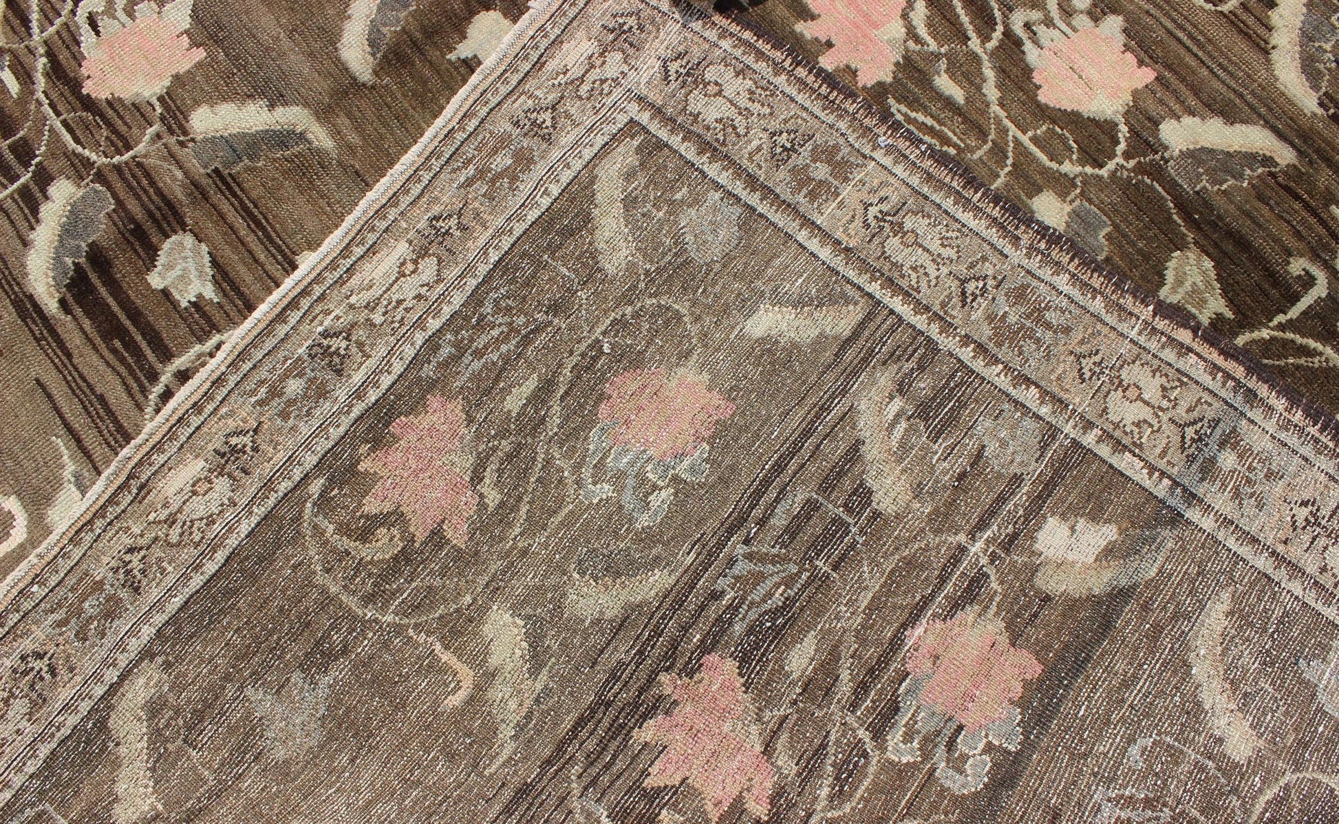Vintage Kars Rug from Eastern Turkey with Rose Design Brown, Green, and Pink Measures: 7'5 x 11'4 Set on a dark greenish - brown background, the all - encompassing floral pattern of this vintage Turkish Kars is unique. The pale pink and pea... - Keivan Woven ArtsTU - MTU - 95044 - 3904Rug