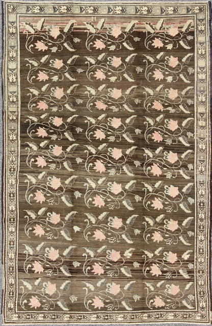 Vintage Kars Rug from Eastern Turkey with Rose Design Brown, Green, and Pink Measures: 7'5 x 11'4 Set on a dark greenish - brown background, the all - encompassing floral pattern of this vintage Turkish Kars is unique. The pale pink and pea... - Keivan Woven ArtsTU - MTU - 95044 - 3904Rug