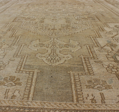 Large Vintage Turkish Floral Medallion Oushak Rug in All Neutral Palette Measures: 7'3 x 13' This muted Turkish Oushak features a light khaki border and background with shades of beige. The corners and central medallion are composed of a... - Keivan Woven ArtsTU - MTU - 95085 - 3692Rug