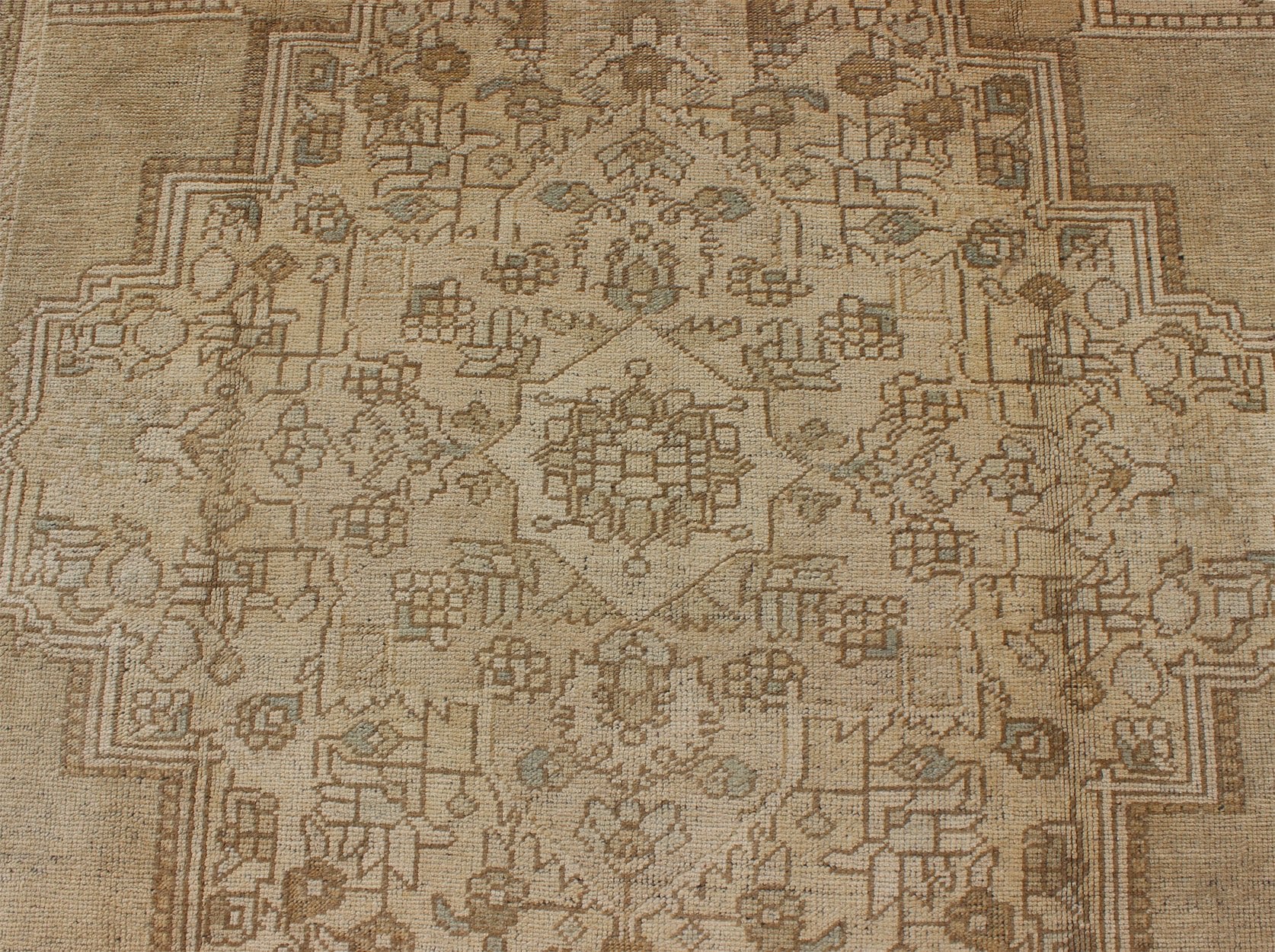 Large Vintage Turkish Floral Medallion Oushak Rug in All Neutral Palette Measures: 7'3 x 13' This muted Turkish Oushak features a light khaki border and background with shades of beige. The corners and central medallion are composed of a... - Keivan Woven ArtsTU - MTU - 95085 - 3692Rug