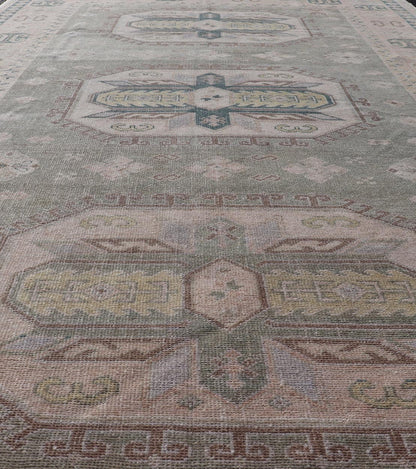 Measures: 6'0 x 9'10 Turkish Vintage Tribal Medallion Oushak in Muted Green, Blue, and Cream. Country of Origin: Turkey; Type: Oushak; Design: Medallion, Tribal Medallion, All - Over, Tribal; Keivan Woven Arts; rug TU - MTU - 991. mid - 20th century. ... - Keivan Woven ArtsTU - MTU - 991 - 21991Rug