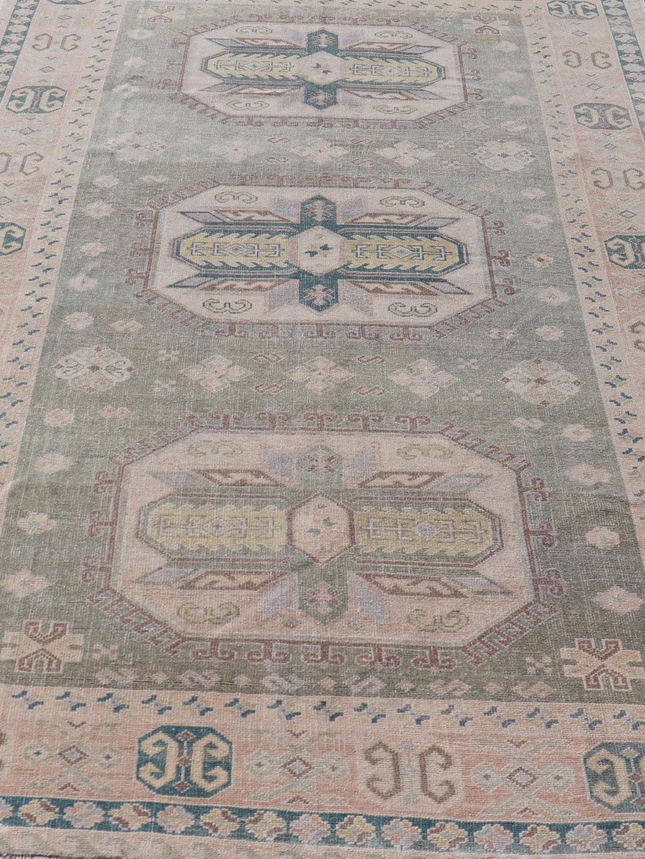 Measures: 6'0 x 9'10 Turkish Vintage Tribal Medallion Oushak in Muted Green, Blue, and Cream. Country of Origin: Turkey; Type: Oushak; Design: Medallion, Tribal Medallion, All - Over, Tribal; Keivan Woven Arts; rug TU - MTU - 991. mid - 20th century. ... - Keivan Woven ArtsTU - MTU - 991 - 21991Rug
