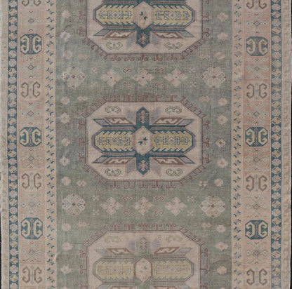 Measures: 6'0 x 9'10 Turkish Vintage Tribal Medallion Oushak in Muted Green, Blue, and Cream. Country of Origin: Turkey; Type: Oushak; Design: Medallion, Tribal Medallion, All - Over, Tribal; Keivan Woven Arts; rug TU - MTU - 991. mid - 20th century. ... - Keivan Woven ArtsTU - MTU - 991 - 21991Rug