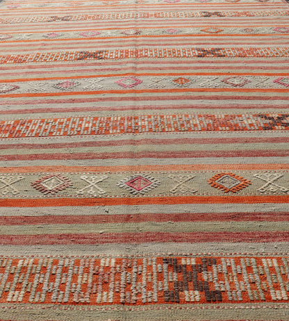 Vintage Turkish Kilim with with Embroideries in Colorful Stripes including Orange, Lt. green, red & gray, charcoal and teal blue. Measures:6'8 x 11'4 Vintage Turkish Kilim rug with geometric shapes and colorful stripes. Keivan Woven Arts / rug TU... - Keivan Woven ArtsTU - NED - 1030 - 14330Rug