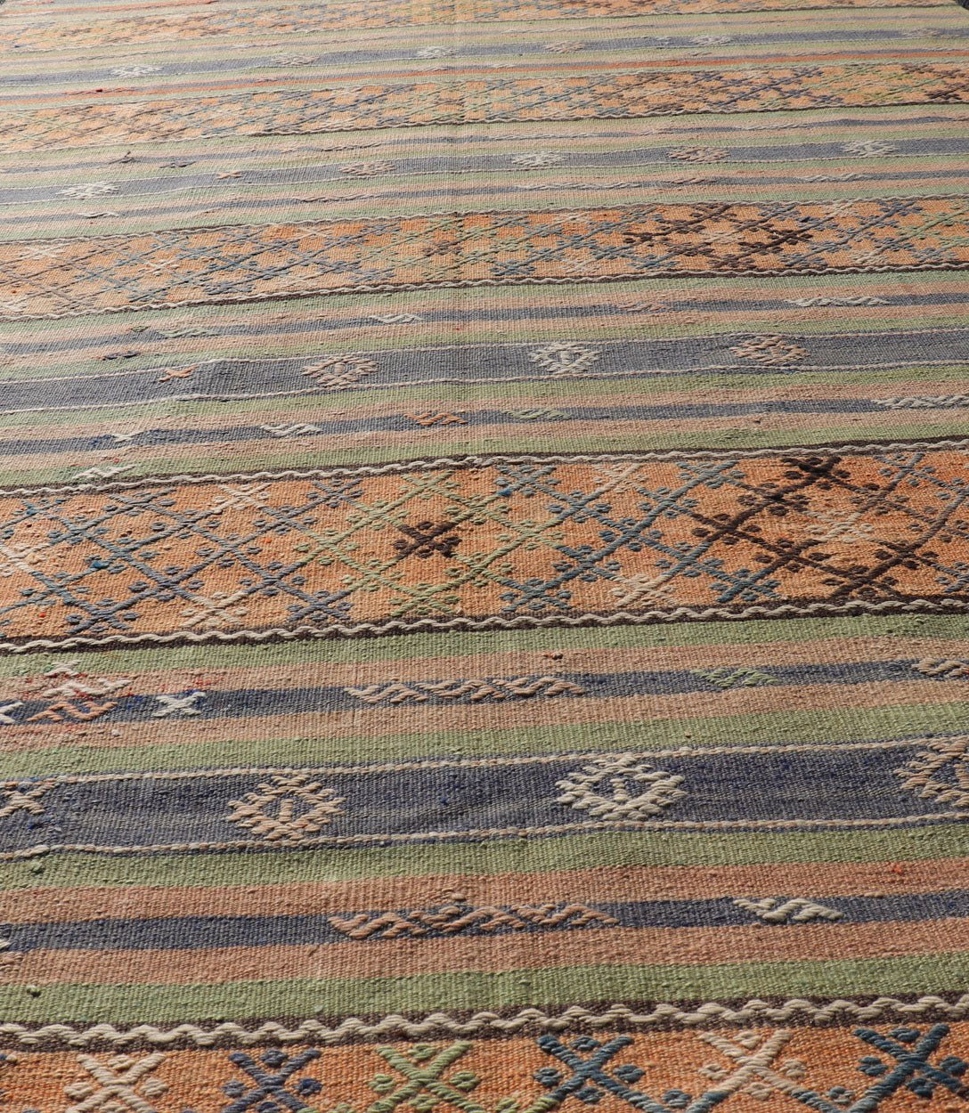 Colorful Turkish Kilim with Stripes and Geometric Motifs in Orange and Green Colorful Turkish Kilim rug with stripes and geometric elements, Keivan Woven Arts / rug TU - NED - 1034, country of origin / type: Turkey / Kilim, circa mid - 20th century. ... - Keivan Woven ArtsTU - NED - 1034 - 14346Rug