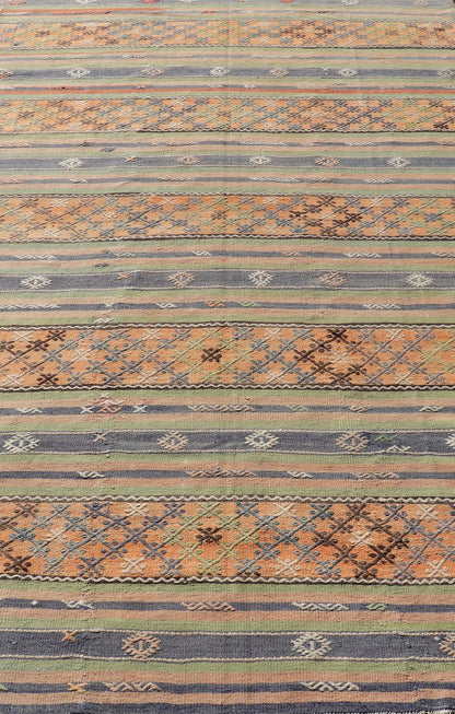 Colorful Turkish Kilim with Stripes and Geometric Motifs in Orange and Green Colorful Turkish Kilim rug with stripes and geometric elements, Keivan Woven Arts / rug TU - NED - 1034, country of origin / type: Turkey / Kilim, circa mid - 20th century. ... - Keivan Woven ArtsTU - NED - 1034 - 14346Rug