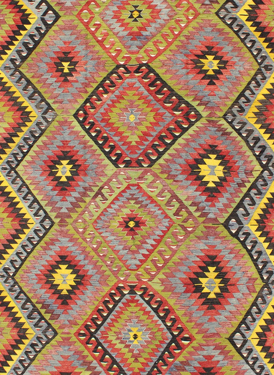 Vintage Turkish Kilim with Diamond Design in Brilliant Multi Colors. Measures: 5'8 x 8'11. This colorful Turkish Kilim boasts a repeating diamond pattern in vivid greens, yellows and reds, giving it a very modern look, perfect for modern and cas... - Keivan Woven ArtsTU - NED - 114 - 3536Rug