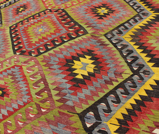 Vintage Turkish Kilim with Diamond Design in Brilliant Multi Colors. Measures: 5'8 x 8'11. This colorful Turkish Kilim boasts a repeating diamond pattern in vivid greens, yellows and reds, giving it a very modern look, perfect for modern and cas... - Keivan Woven ArtsTU - NED - 114 - 3536Rug
