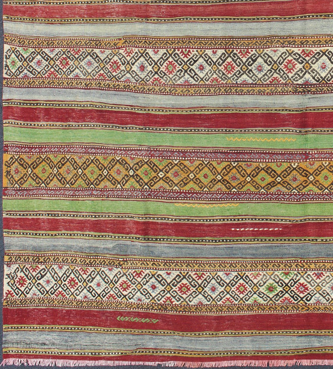 Fine Weave Turkish Kilim with Embroidery - With a combination of stripe and diamond patterns, this beautiful Kilim features intense and vivid colors of green, red, gray, purple, gold, orange, brown, and ivory. Measures: 6'2 x 9'2. - Keivan Woven ArtsTU - NED - 115 - 3540Rug