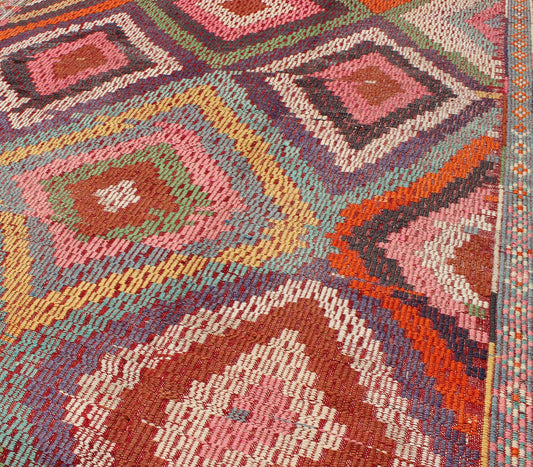 Vintage Turkish Jajim/Kilim Rug with Broken Diamond Pattern and Vibrant Colors: This wonderful Turkish Jajeem from the 1950's features a multi - diamond pattern rendered in a chic color palette. The broken diamond pattern, along with the very beautiful a... - Keivan Woven ArtsTU - NED - 128 - 3554Rug