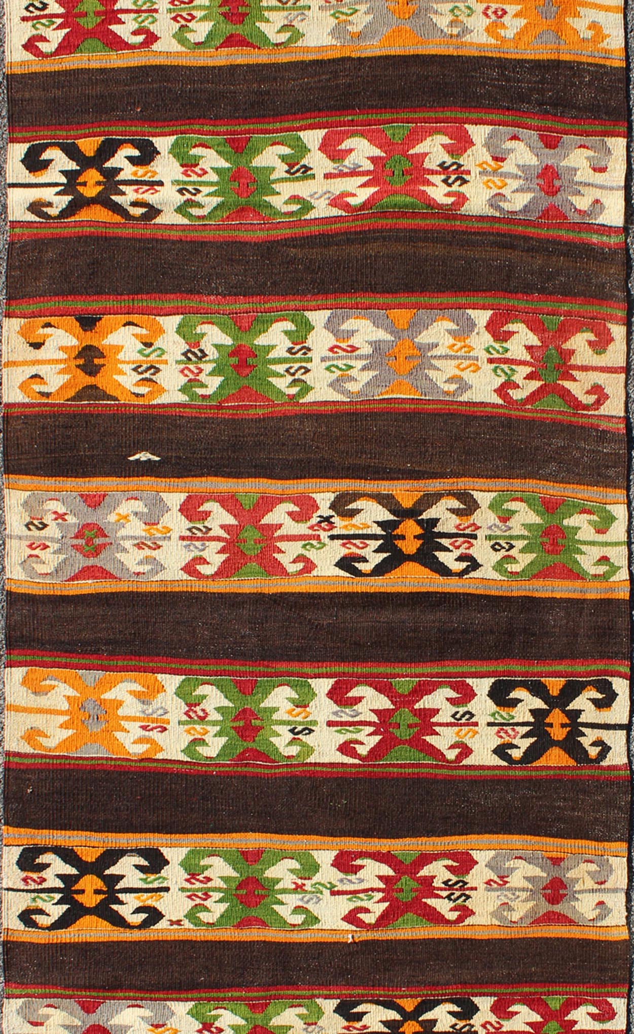 Keivan Woven Arts - Vintage Turkish Kilim rug with Vivid colors and tribal stripes on charcoal background, rug TU - NED - 132, country of origin / type: Turkey / Kilim, circa mid - 20th century. Featuring tribal elements rendered in a repeating horizon... - Keivan Woven ArtsTU - NED - 132 - 3576Rug