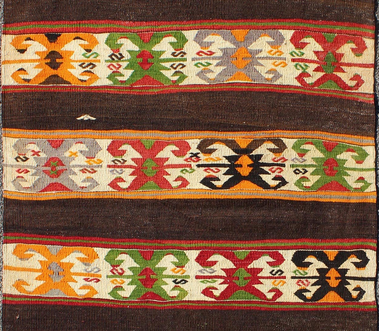 Keivan Woven Arts - Vintage Turkish Kilim rug with Vivid colors and tribal stripes on charcoal background, rug TU - NED - 132, country of origin / type: Turkey / Kilim, circa mid - 20th century. Featuring tribal elements rendered in a repeating horizon... - Keivan Woven ArtsTU - NED - 132 - 3576Rug