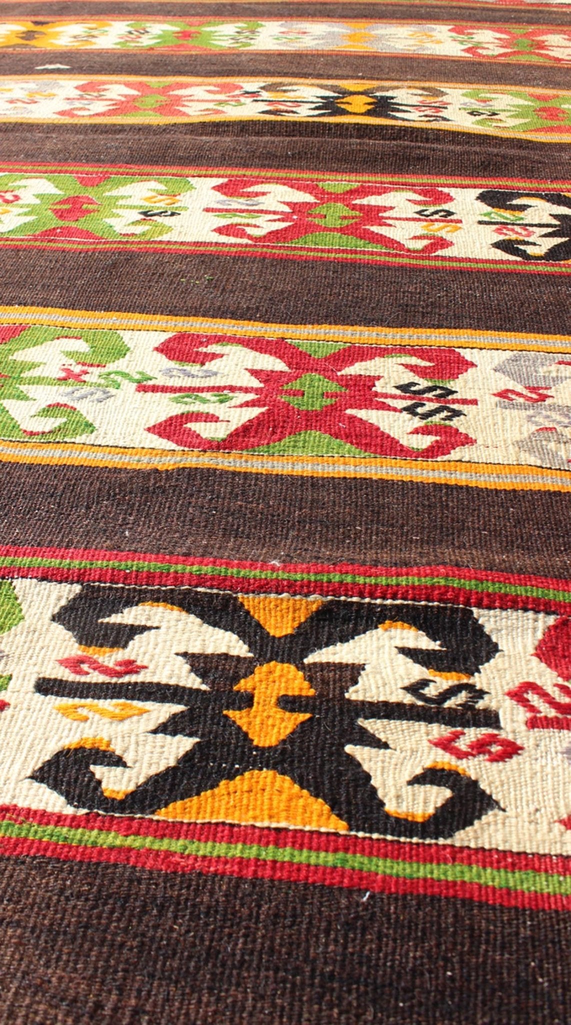 Keivan Woven Arts - Vintage Turkish Kilim rug with Vivid colors and tribal stripes on charcoal background, rug TU - NED - 132, country of origin / type: Turkey / Kilim, circa mid - 20th century. Featuring tribal elements rendered in a repeating horizon... - Keivan Woven ArtsTU - NED - 132 - 3576Rug