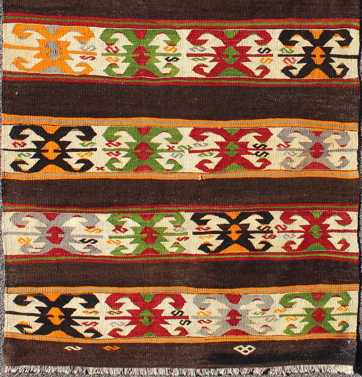 Keivan Woven Arts - Vintage Turkish Kilim rug with Vivid colors and tribal stripes on charcoal background, rug TU - NED - 132, country of origin / type: Turkey / Kilim, circa mid - 20th century. Featuring tribal elements rendered in a repeating horizon... - Keivan Woven ArtsTU - NED - 132 - 3576Rug