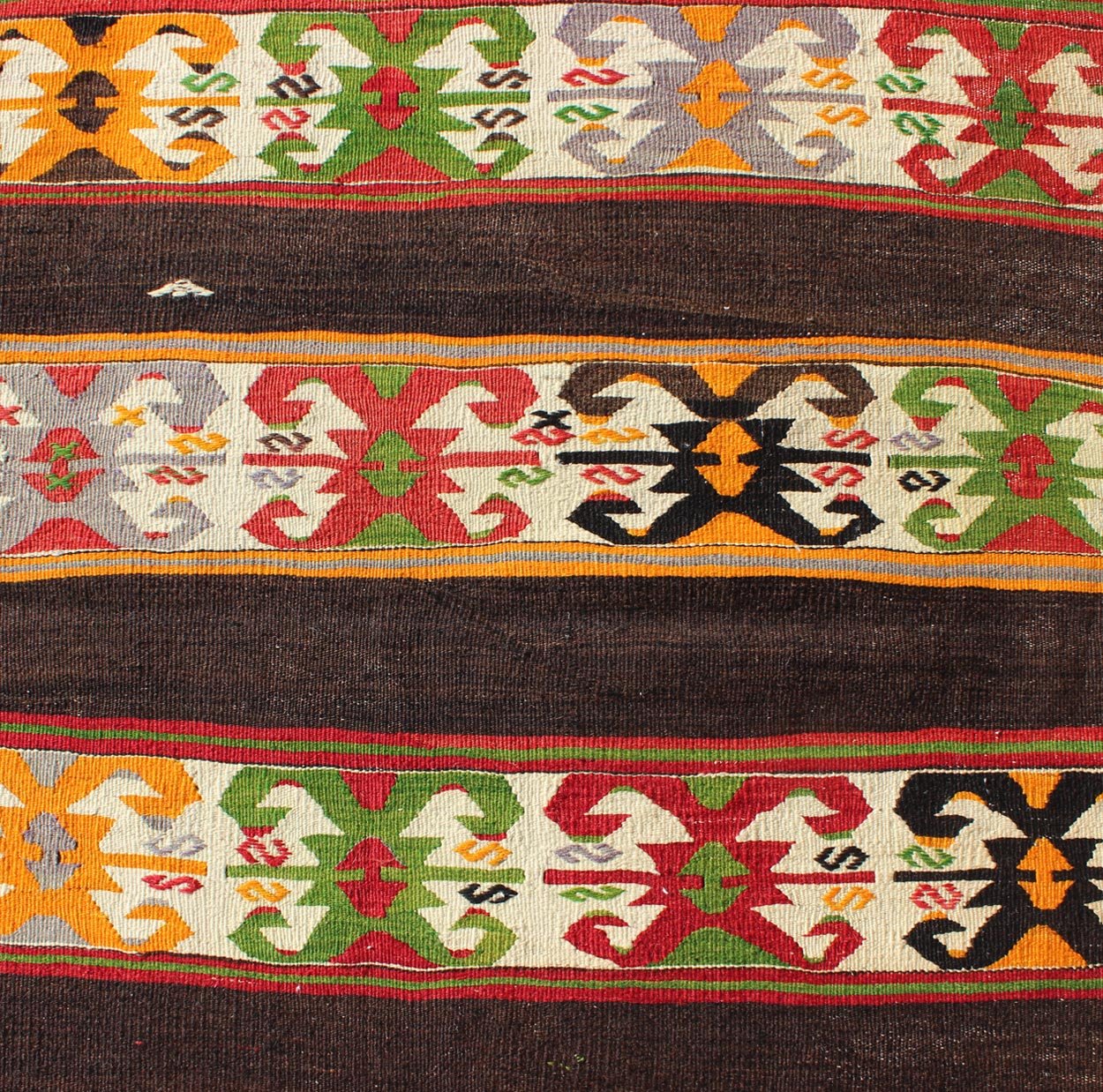 Keivan Woven Arts - Vintage Turkish Kilim rug with Vivid colors and tribal stripes on charcoal background, rug TU - NED - 132, country of origin / type: Turkey / Kilim, circa mid - 20th century. Featuring tribal elements rendered in a repeating horizon... - Keivan Woven ArtsTU - NED - 132 - 3576Rug