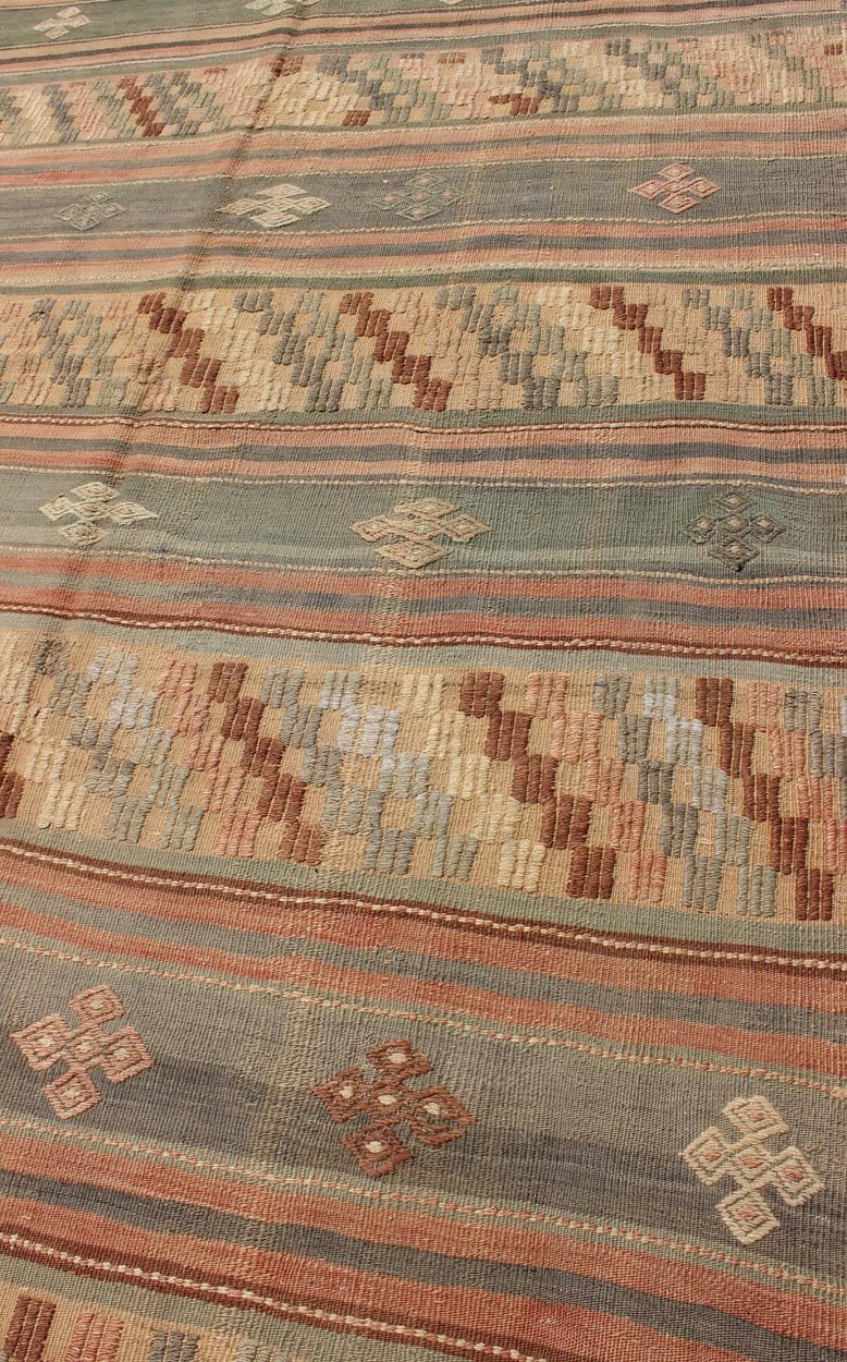 Vintage Turkish Tribal Kilim with Striped Design in Earthy Tones Measures: 5'4 x 9'8 This lovely Turkish Kilim has a striped, repeating pattern with clover motifs. The dark taupe - green stripes home the embroidered clovers, whereas the lig... - Keivan Woven ArtsTU - NED - 134 - 3562Rug